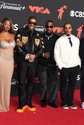 Cacie Smith and Busta Rhymes attend 2025 MTV VMAs in crest-clad contrast