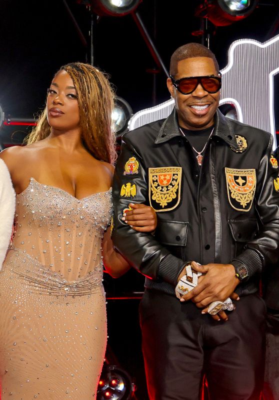 Cacie Smith and Busta Rhymes attend 2025 MTV VMAs in crest-clad contrast