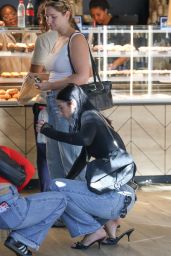 Charli D’Amelio Embodies Paris Street Style in Asymmetric Denim Look