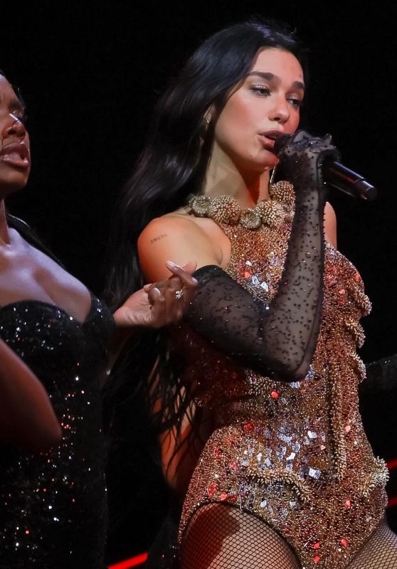 Dua Lipa Ignites the Stage in Sculptural Bronze Bodysuit