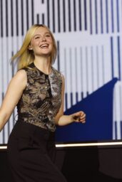 Elle Fanning Embodies Comic-Con Chic In Sequined Top And Effortless Wide-Leg Trousers
