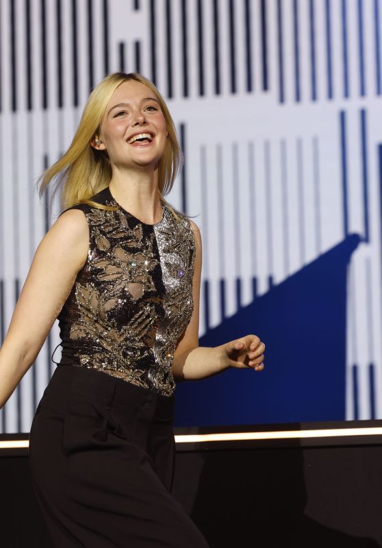 Elle Fanning Embodies Comic-Con Chic In Sequined Top And Effortless Wide-Leg Trousers