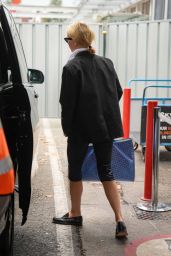 Gwyneth Paltrow Embodies Milan Arrival in Blazer and Blue-Tote Ease