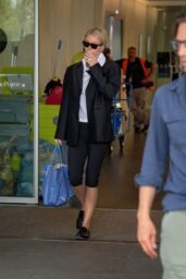 Gwyneth Paltrow Embodies Milan Arrival in Blazer and Blue-Tote Ease
