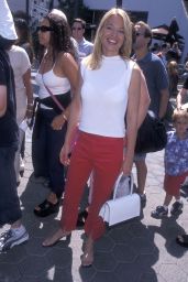 Jeri Ryan Attends ‘Rocky and Bullwinkle’ Premiere in Scarlet Slit Pants – LA 2000