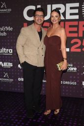 Rhian Sugden Unveils Classic Glamour In Deep Burgundy Draped Gown