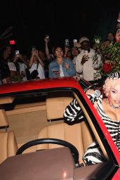 Doja Cat Defines Power Dressing with Graphic Corset and Blue Tights
