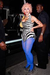 Doja Cat Defines Power Dressing with Graphic Corset and Blue Tights