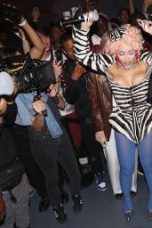 Doja Cat Defines Power Dressing with Graphic Corset and Blue Tights