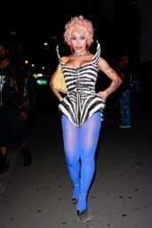 Doja Cat Defines Power Dressing with Graphic Corset and Blue Tights