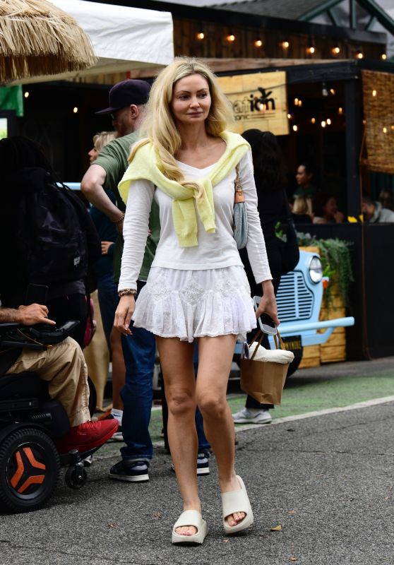 Gia Skova Channels Resort Chic in Layered White Ensemble