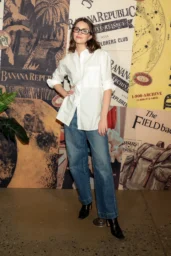 Ella Hunt posing in white button-down shirt and wide-leg jeans at Banana Republic Explorers Club event NYC April 2026