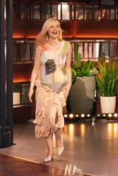 Elle Fanning posing in Yusho Kobayashi patchwork dress with Thom Browne pumps at The Kelly Clarkson Show April 2026
