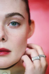 lle Fanning posing in multiple high fashion looks for ELLE UK May 2026 photoshoot featuring red, black, and cream editorial stylinga