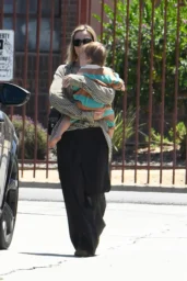 Margot Robbie walking in Los Angeles with Chanel 25 Small Bag April 2026