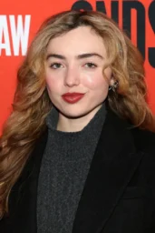 Peyton Roi List posing in a black coat and gray knit at Becky Shaw opening night, New York City, April 2026