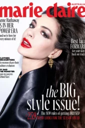 Anne Hathaway in glossy black outerwear with red lipstick on Marie Claire Australia September 2026