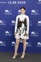 Kate Mara in black-and-white Alexander McQueen lace minidress at the Bucking Fastard Venice photocall
