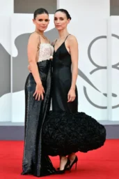 Kate Mara and Rooney Mara in contrasting black evening gowns at the Bucking Fastard screening in Venice