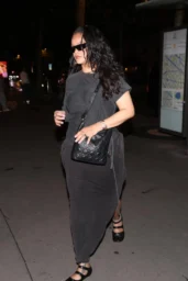 Rihanna in a charcoal one-sleeve top and long skirt outside Maison Paillard in Paris
